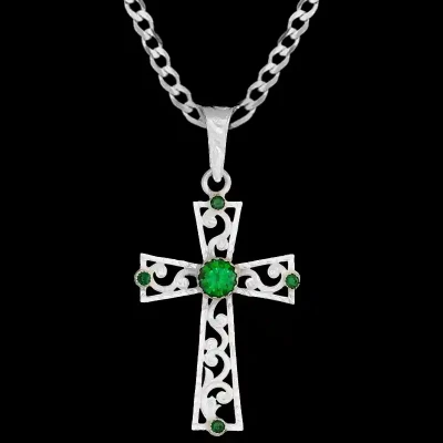 A custom silver cross pendant necklace for men and women, western-inspired design. featuring silver filigrane and green zirconia stones